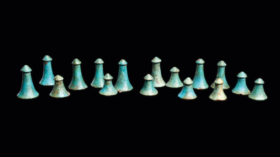 Egyptian Faience Senet Game Pieces, New Kingdom, Group of 16: North Africa, Egypt, New Kingdom, 19th to 20th Dynasty, ca. 1320–1085 BCE. A group of sixteen faience gaming pieces glazed in the luminous blue-green of Egyptian craft, eight tall and eight shor