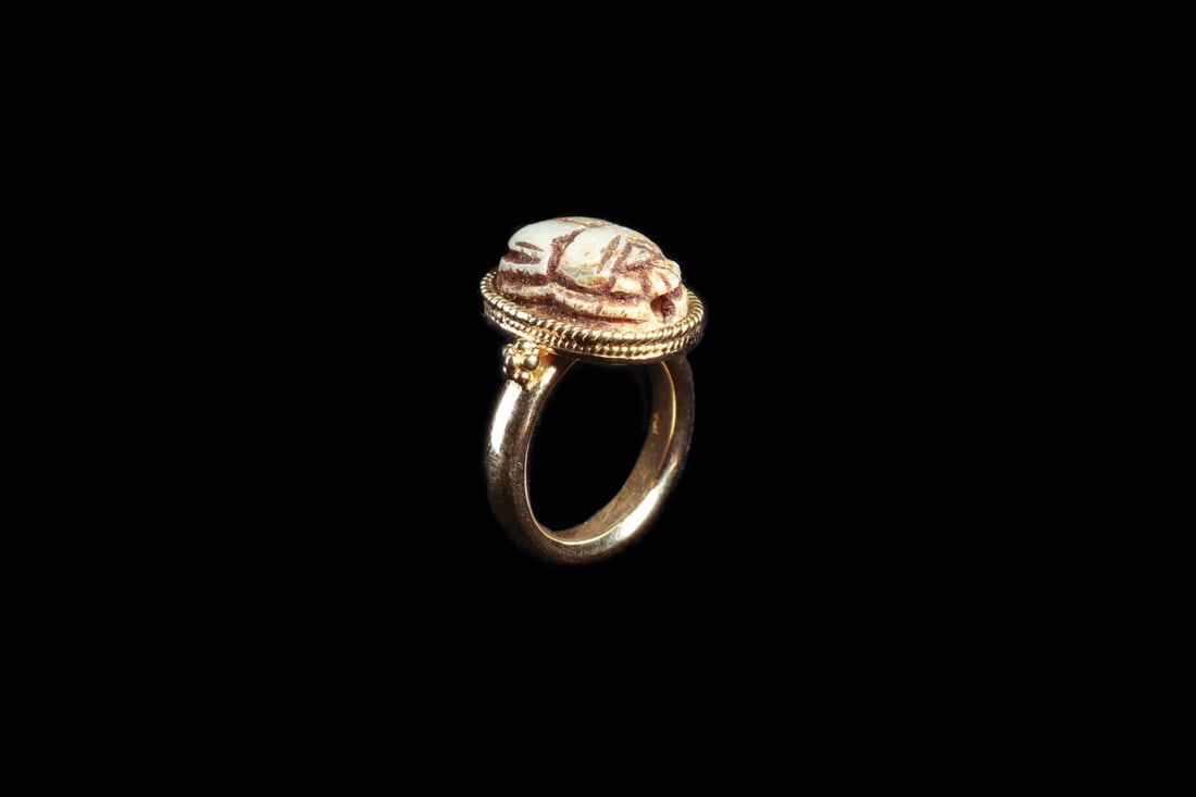 Egyptian Late Period Steatite Scarab in 1920s Gold Ring: Egypt, Late Period; setting European, 20th C. Ca. 700–30 BCE. A carved steatite scarab of bluish-cream tone, its dorsal plate crisply modeled with clypeus, prothorax, and folded elytra, the surf