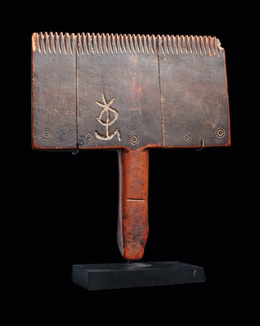 Coptic Wooden Weaver's Comb with Owner's Mark, 5th C. Egypt: Egypt, Coptic, ca. 400–500 CE. A weaver's beating comb built from three joined wooden panels, its broad rectangular head cut into a dense row of slender teeth and dropping to a long tapered hand