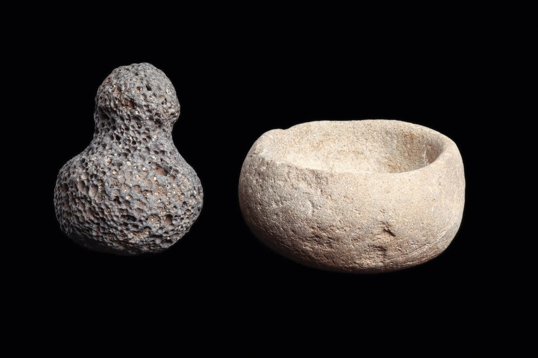 Hawaiian Stone Medicine Bowl & Lava Pounder with Mushroom Finial, Miniature (2): Oceania, Hawaiian Islands, Native Hawaiian, 1799 CE. A pair of small ground-stone implements for the preparation of medicines. The bowl is a pale gray stone of unadorned organic form, its loosely tape