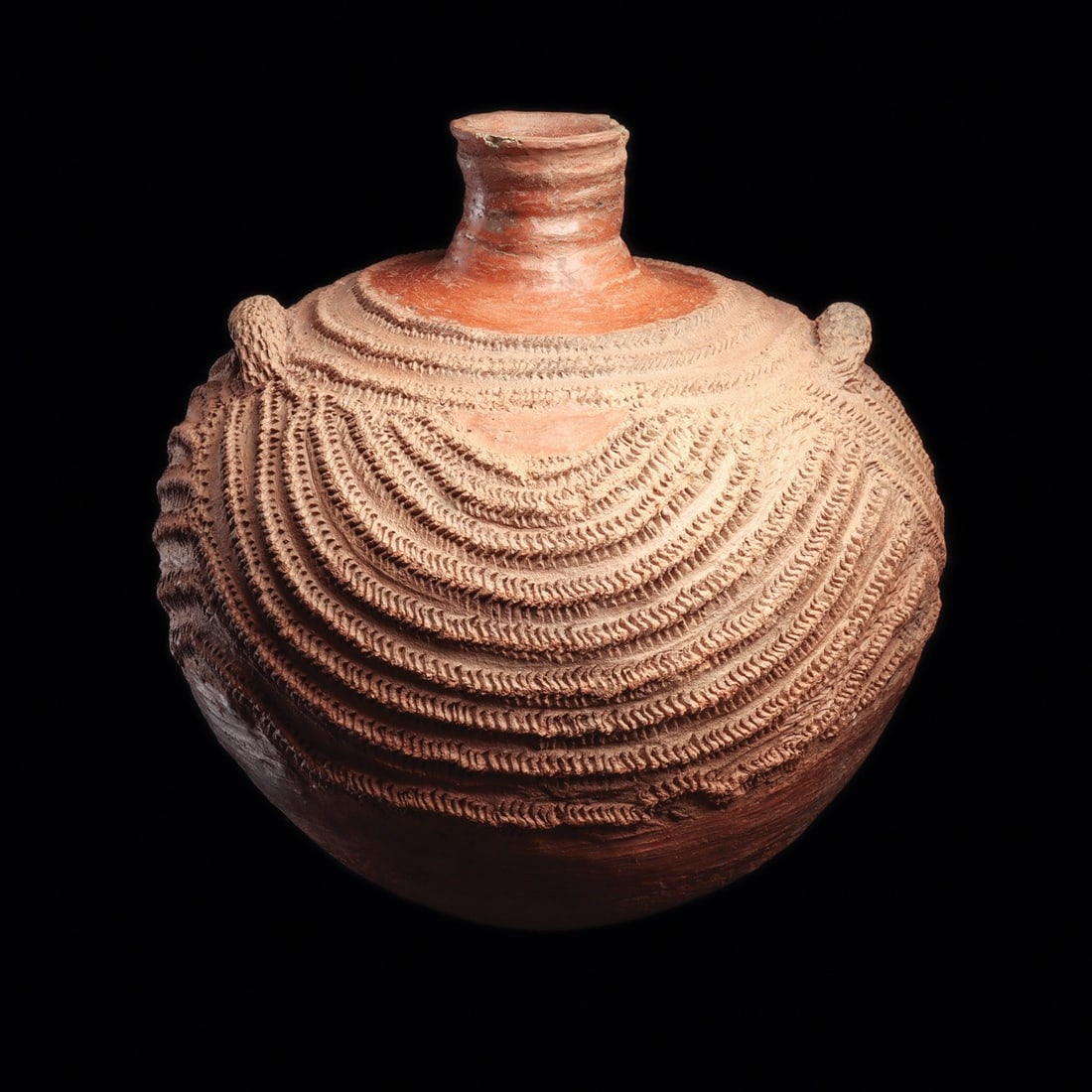 Bozo Roulette-Decorated Terracotta Storage Vessel, Mali: West Africa, Mali, probably Bozo, ca. 1900–1975 CE. A globular terracotta storage jar of red-brown clay, hand-built and rising to a short flaring neck above a swelling shoulder. Dense roulette i