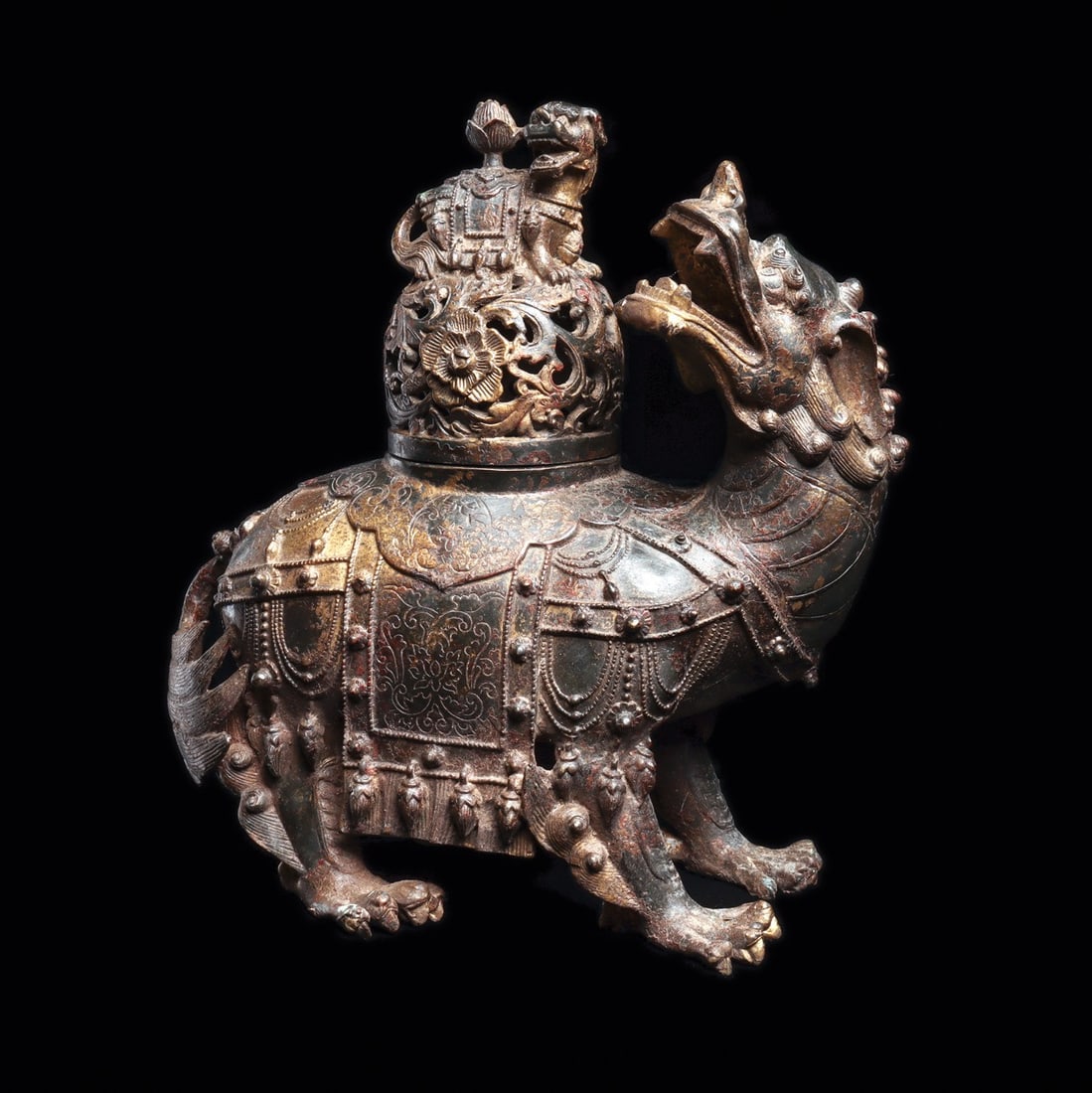 Qing Dynasty Guardian Lion Censer with Openwork Lid, 19th C.: East Asia, China, Qing Dynasty, ca. 1800–1899 CE. A mythological guardian lion cast in the round, head wrenched back over one shoulder, jaws flung open around bared fangs beneath a mane of tight