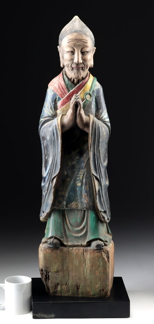 19th C. Qing Dynasty Wood Lohan Statue, Consecration Niche: Ca. 1800–1900 CE. East Asia, China, Qing Dynasty, ca. 19th century CE. A carved wooden figure of a monk standing on a plinth, hands clasped in front of the chest in Anjali Mudra (also known as N