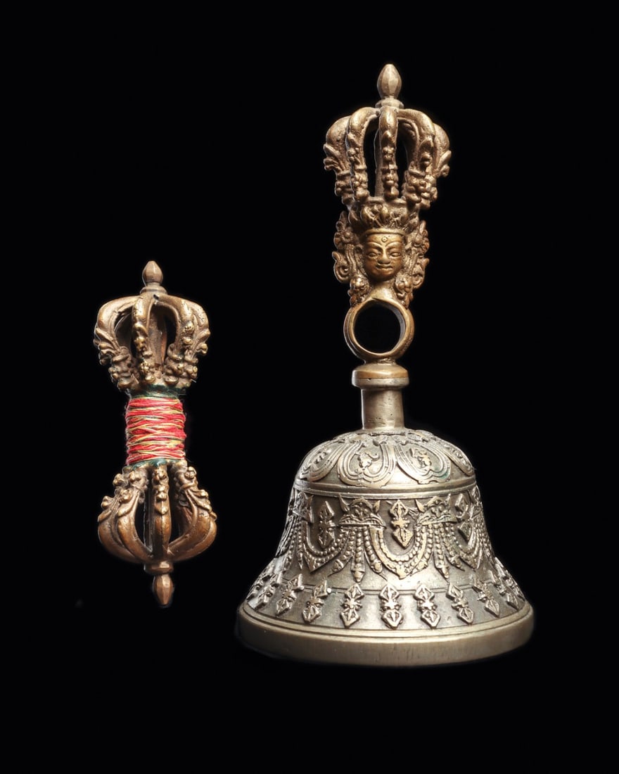 Tibetan Vajra Dorje and Ghanta Bell with Prajnaparamita Head, 18th C.: East Asia, Tibet, ca. 1700–1799 CE. A paired set of Tantric ritual implements, cast in a bronze-type alloy. The dorje (vajra) is symmetrical, its two ends each closing into eight curved prongs a