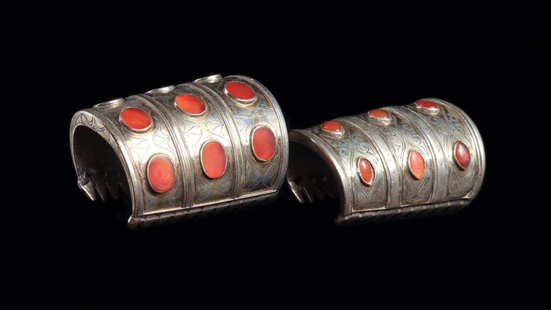 Turkmen Silver Cuff Bracelets with Carnelian Cabochons, 19th C. (2): Central Asia, Afghanistan or Turkmenistan, Turkmen culture, ca. 1800–1900 CE. A matched pair of broad silver cuffs, each rolled into a deep tubular sleeve that would have sheathed the forearm ne