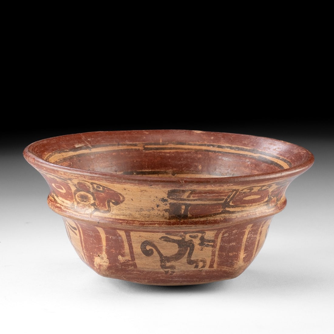 Maya Copador Polychrome Bowl - Avian & Monkey Frieze: Pre-Columbian, Guatemala/Honduras, Maya, ca. 600–900 CE. A polychrome earthenware bowl of unusual profile, its lower body drawn into a soft pillow of four gentle corners above a rounded base, th