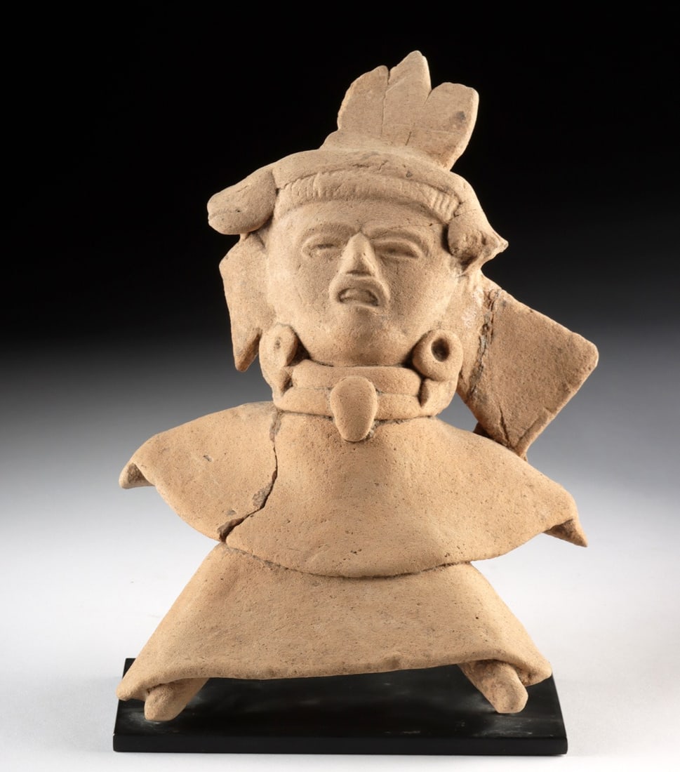 Veracruz Whistle Figure, Buff Clay, Feathered Crest: Pre-Columbian, Mexico, Veracruz, ca. 100–800 CE. Mold-made in buff clay, this whistle figure from ancient Veracruz portrays a standing figure in full regalia: heavy-lidded eyes, a strong nose, a