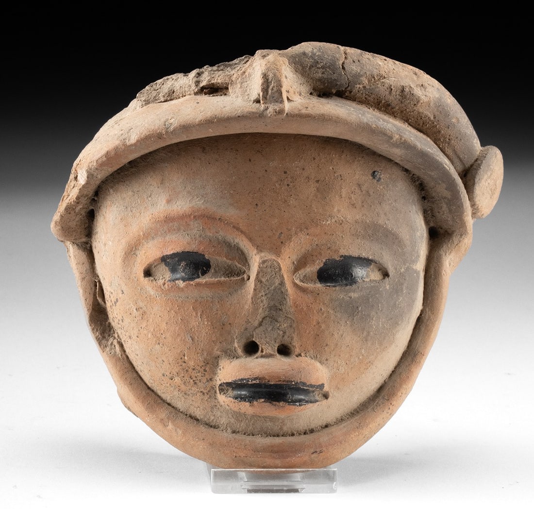 Veracruz Remojadas Pottery Head w/ Bitumen: Ca. 200–900 CE. Pre-Columbian, Gulf Coast of Mexico, Veracruz, Remojadas culture, ca. 3rd to 9th century CE. A hand-built pottery head fragment from a larger statue or incense vessel. A strap un