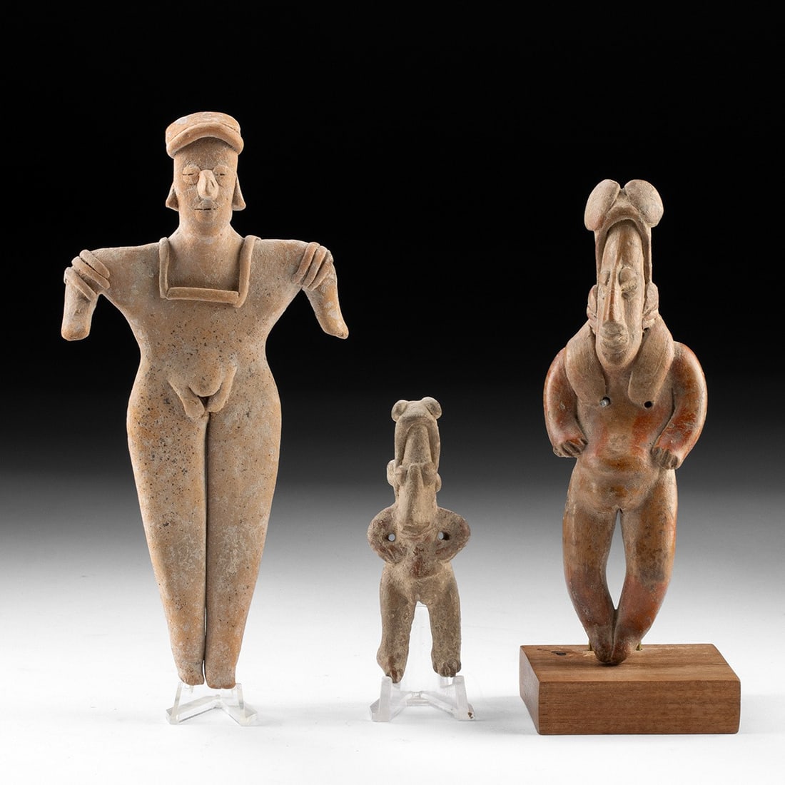 Colima & Jalisco Pottery Nude Female Figures, Group of 3: Pre-Columbian, West Mexico, Colima and Jalisco, ca. 300 BCE – 300 CE. A trio of buff-clay female figures from the shaft-tomb cultures of West Mexico, each rendered with frank attention to the nu
