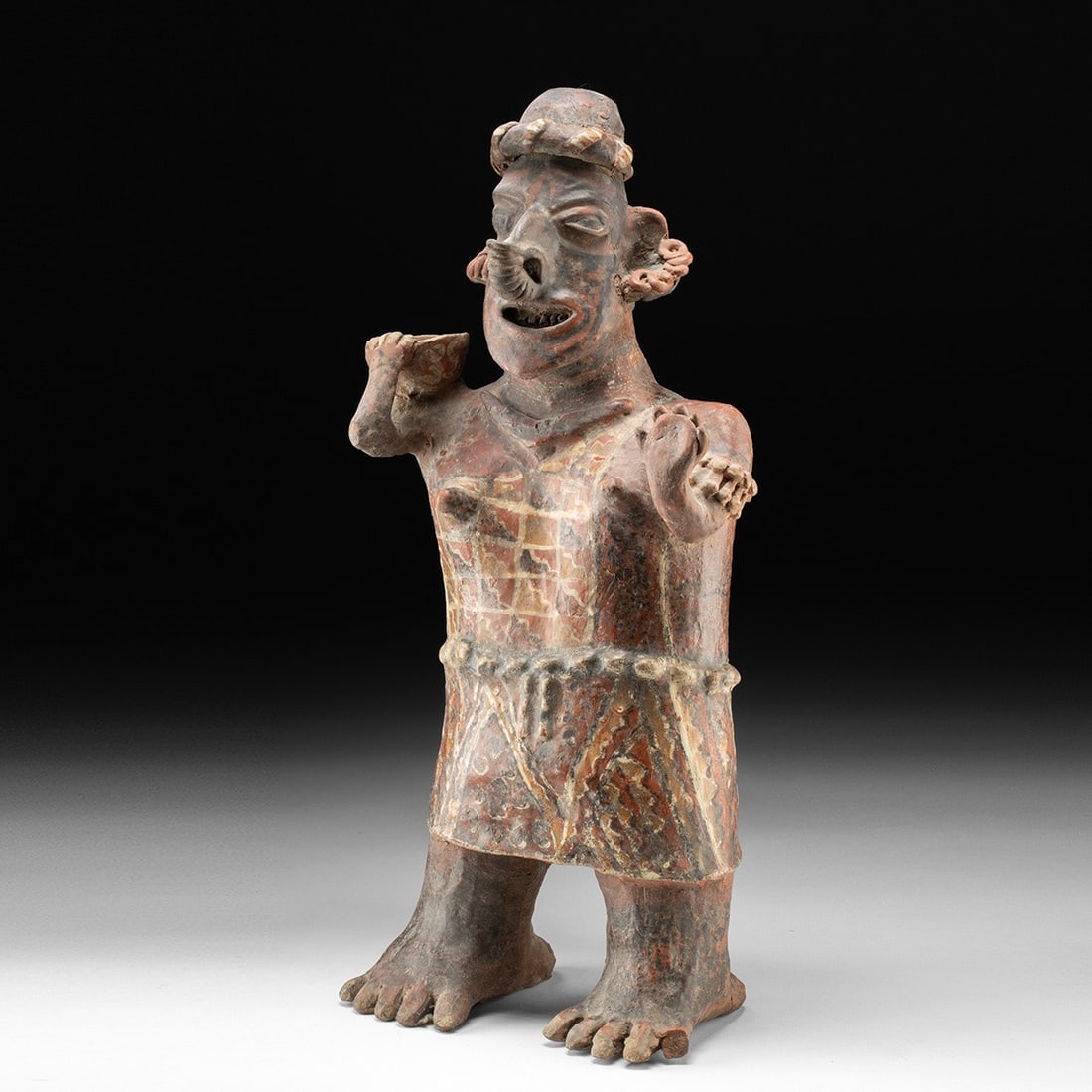 Nayarit Ixtlan del Rio Semi-Nude Female Figure w/ Bowl: Pre-Columbian, West Mexico, Nayarit, Ixtlan del Rio style, ca. 300 BCE – 300 CE. A commanding standing woman modeled in burnished buff clay and painted in resist and slip tones of oxide red, cre