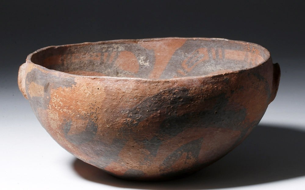 Rare Argentinean San Jose Polychrome Pottery Bowl: 1000 CE. Pre-Columbian, South America, Argentina, San Jose region, ca. 1000 CE. A large and deep terracotta vessel with opposing low relief crescent handles and a convex base. Most impressive is the p