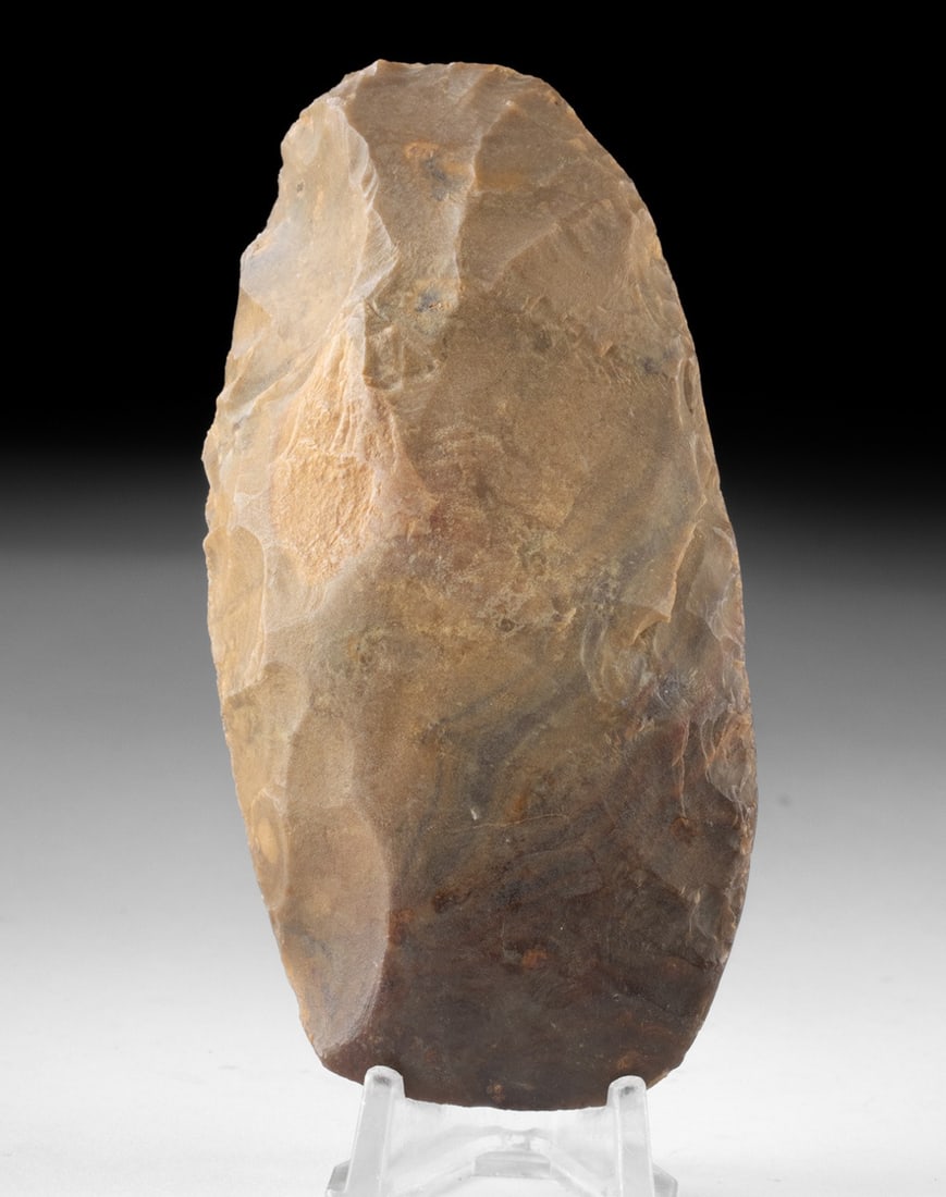 Mousterian Neanderthal Stone Hand Tool From Mali: Ca. 120,000–40,000 BCE. West Africa, Mali, Mousterian Period, ca. 120,000 to 40,000 years old. A handsome chert biface, a stone tool made by Homo neanderthalensis to use as a hand axe. The tool 
