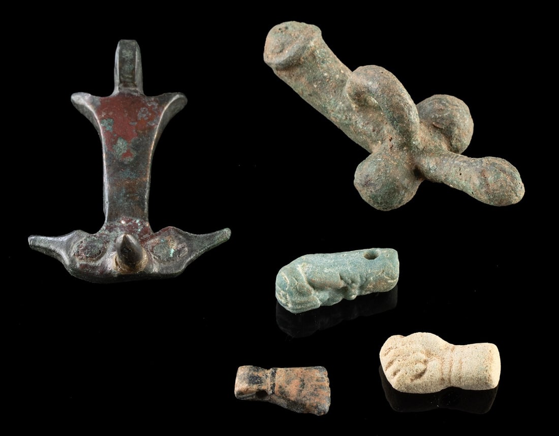 5 Roman & Romano-Egyptian Apotropaic Amulets | Fascina & Evil Eye Talismans: Ca. 1–400 CE. Roman and Romano-Egyptian, Imperial period, ca. 1st to 4th century CE. A cohesive group of five apotropaic amulets representing two of the most potent protective forms circulating 