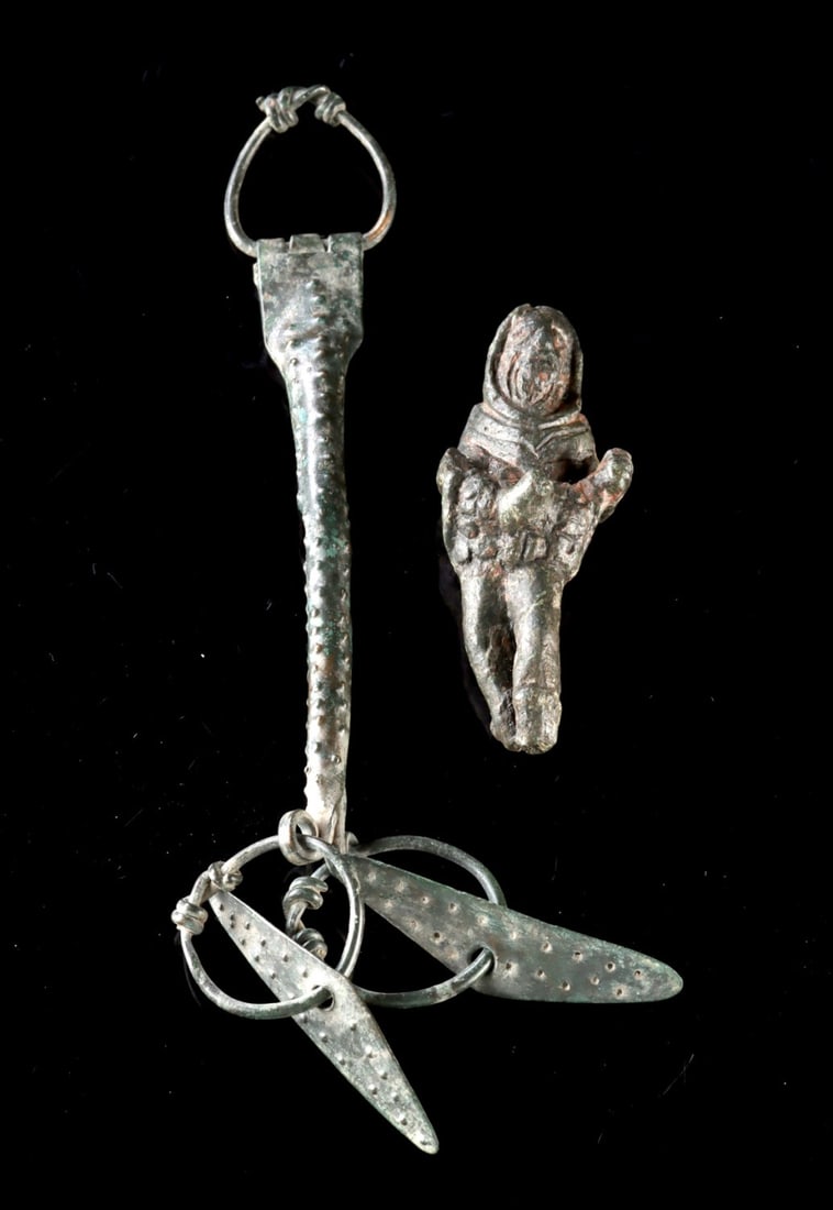 Roman Bronze Priapus Figure + Anglo-Saxon Chatelaine: Ca. 201–251 CE. Roman empire. 500 to 700 CE. Interesting pair of ancient objects! First, a cast bronze Priapus. Priapus was a minor Greek fertility god and protector of male genitalia. He is sho