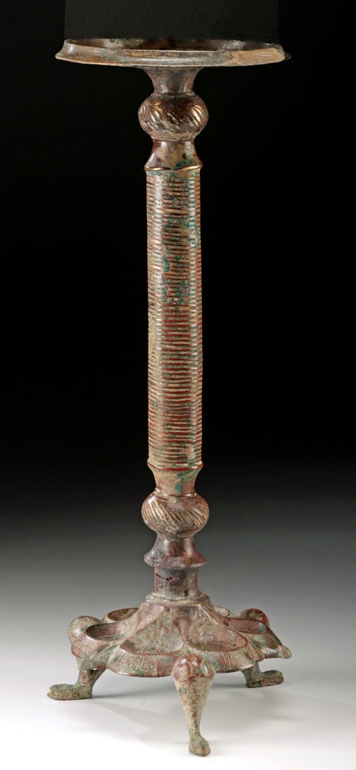 Persian Siljuk Bronze Lamp Stand, Khorasan Region: Ca. 1000–1300 CE. Near East / Central Asia, Persia (Iran), likely Khorasan region, Abbasid / Seljuk (Saljuq) Empire, ca. 11th to 13th CE. A tall leaded-bronze lamp stand with a baluster form, re