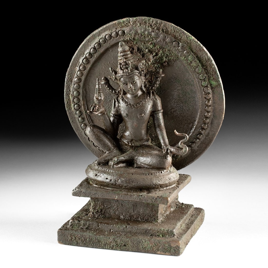19th C. Western Himalayan Brass Bodhisattva Maitreya with Kamandalu: Western Himalaya, Kashmiri revival style, ca. 1800–1899 CE. A cast brass shrine figure of the bodhisattva Maitreya, seated in lalitasana with one leg pendant and the other folded, set against a 