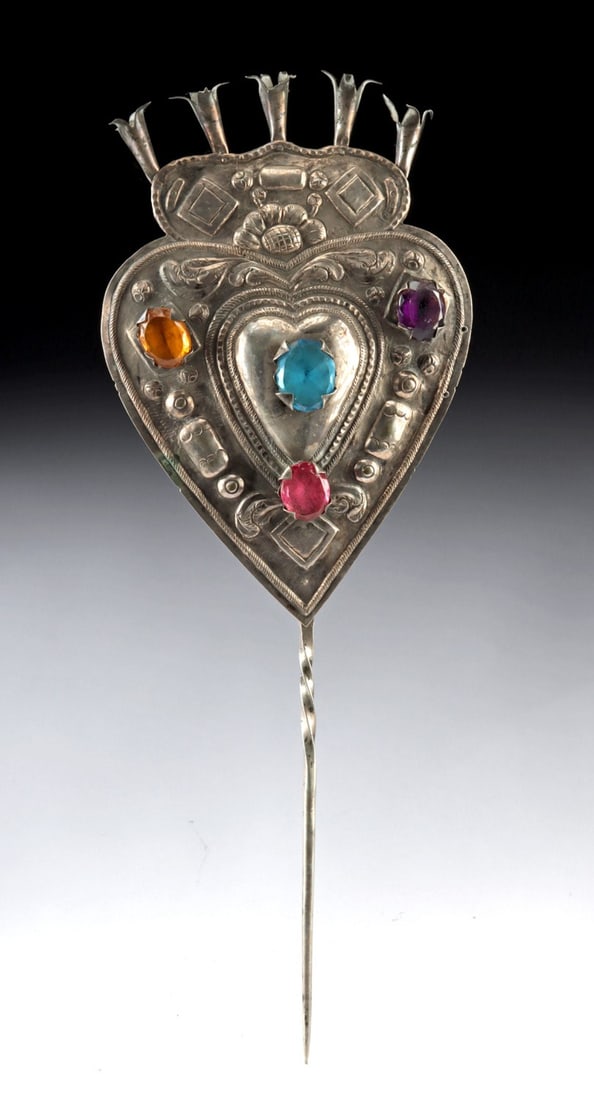 Bolivian Silver Tupu Pin | Heart-Shaped Finial | Glass Inlay, ex-Holler & Saunders: Ca. 1800–2000 CE. South America, Bolivia, ca. 19th to early 20th century CE. A magnificent silver tupu pin with vivid semi-translucent faceted glass inlays set within a heart-shaped finial. The 