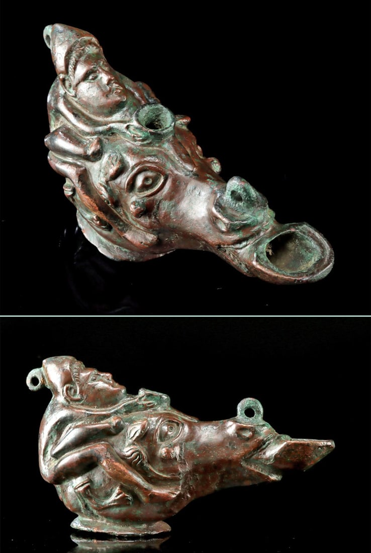 Romano-Egyptian Bronze Lamp Erotic Satyr Equestrian: Ca. 200–100 BCE. Roman, Egypt, ca. 2nd century BCE. A very heavy bronze oil lamp of a generally pear shape depicting a humanized Satyr riding a horse in a somewhat erotic fashion. The lamp has a