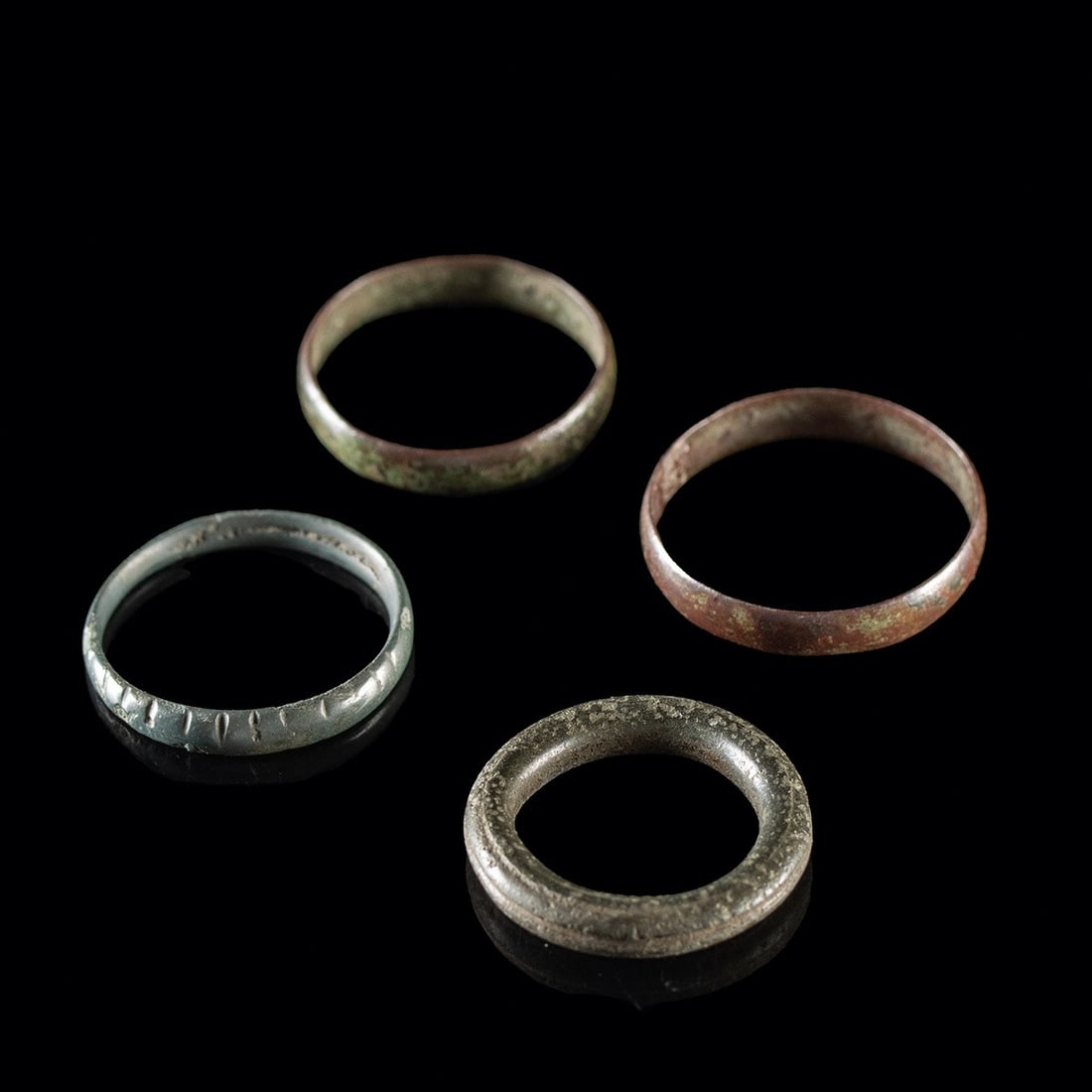 Four Roman and 19th C. Metal Rings: Roman, Imperial period; and Europe or North America, industrial period, ca. 100–1950 CE. A quartet of plain circlets spanning nearly two millennia of the same simple idea. The smallest is a tubu
