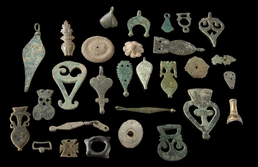 European Late Roman to Post-Medieval Bronze & Iron Fittings: Ca. 200–1700 CE. Western Europe, Late Roman & Byzantine to Post Medieval periods, ca. 3rd to 17th century CE. A collection of small bronze, brass, and iron artifacts, including pendants, strap f