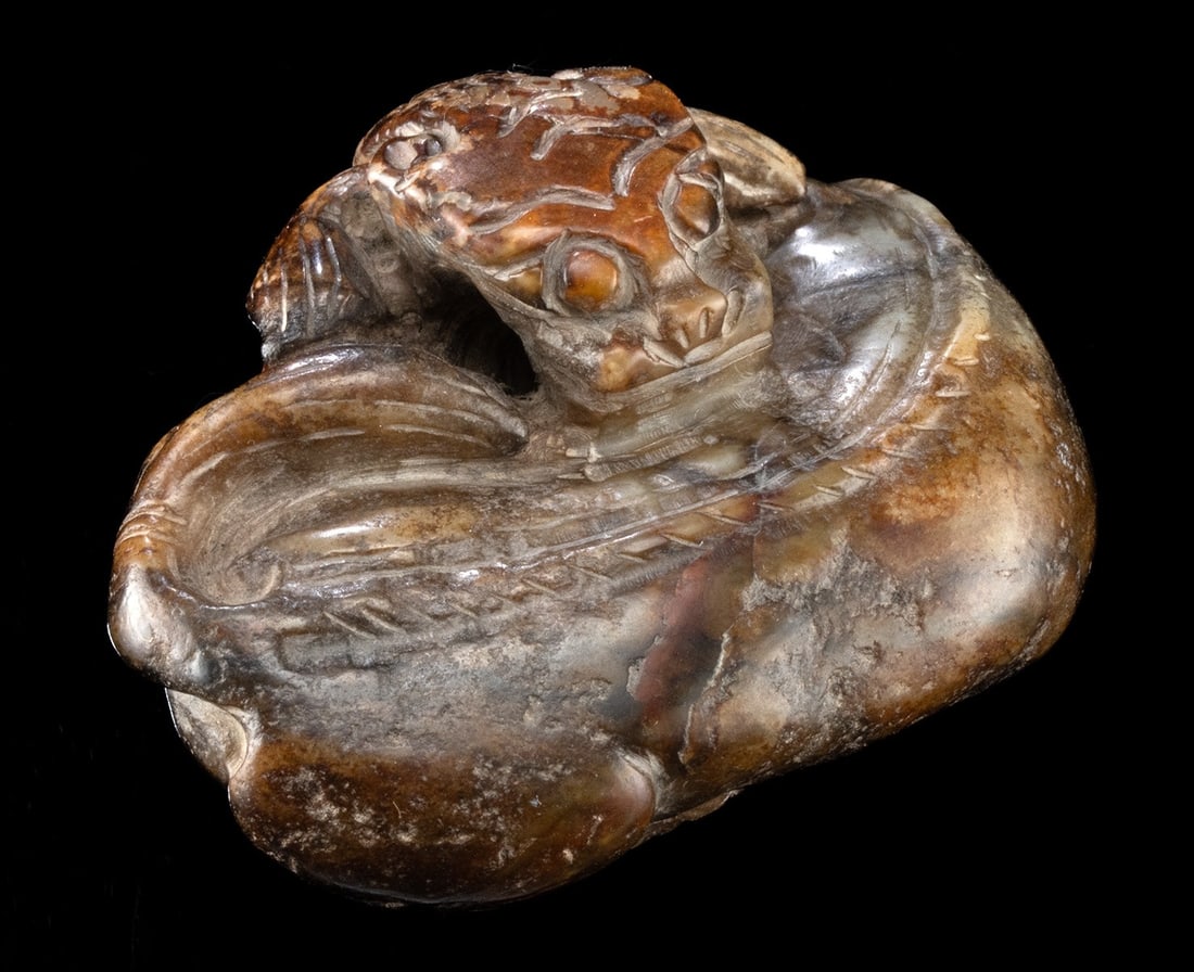 Chinese Ming Dynasty Khotan Jade Coiled Mythical Beast: Ca. 1800–1900 CE. East Asia, China, Qing Dynasty, ca. 19th century CE. A lovely mutton jade (nephrite) carving of a mythical beast resembling a coiled, recumbent tiger. Boasting natural hues of 