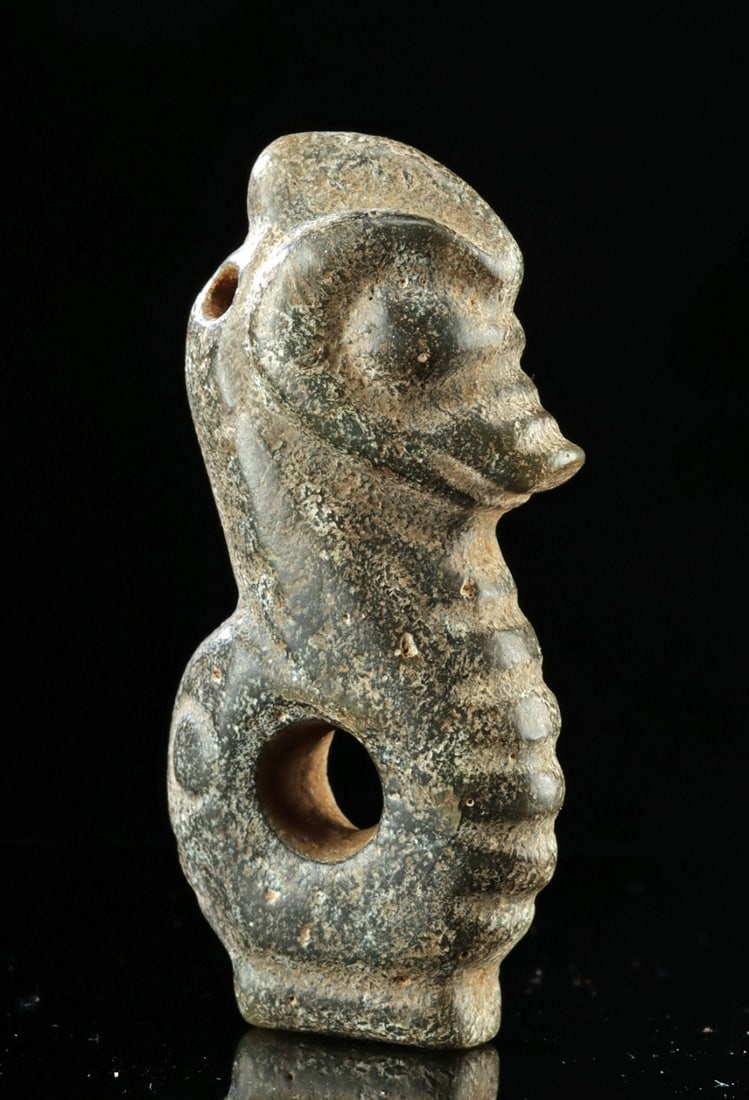 19th C. Chinese Qing Nephrite Jade Pig Dragon Carving: Ca. 1800–2000 CE. East Asia, China, Qing Dynasty to Republic era, ca. late 19th to 20th century CE. A hand-carved nephrite jade amulet crafted in the form of an abstract zoomorphic figure, commo