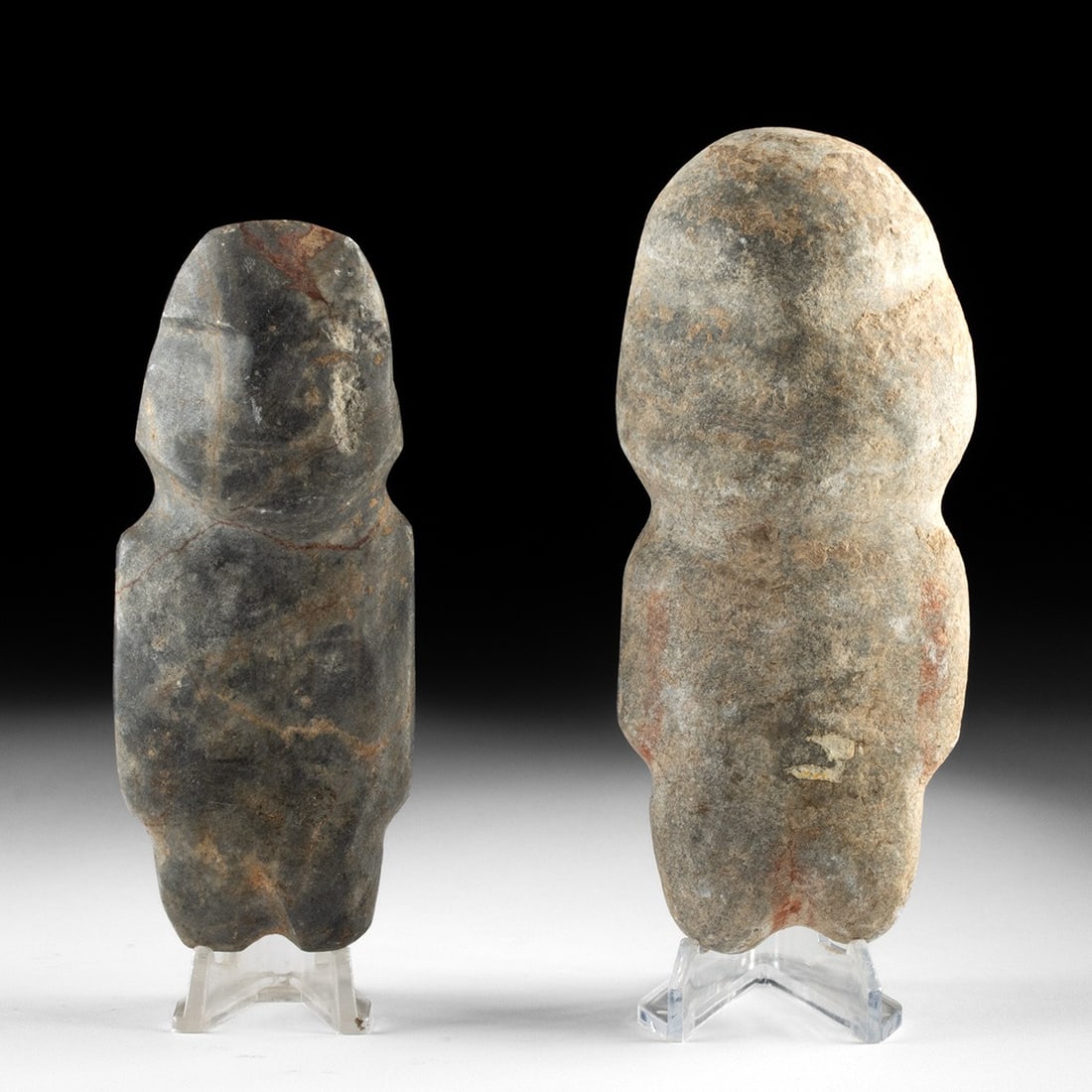 Pre-Columbian Mezcala Stone Axe God Figures, Pair: Pre-Columbian, Mexico, Guerrero, Mezcala, ca. 500 BCE – 300 CE. A pair of abstracted anthropomorphic figures carved from dense grey stone in the distinctive idiom of the Mezcala lapidaries of an