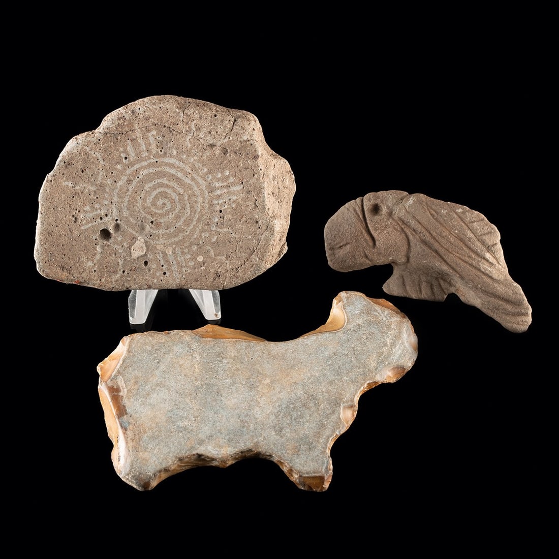 Great Basin, Mississippian & Woodland Stone Effigies & Petroglyph (3): Native American, Great Basin, Mississippian and Woodland cultures, ca. 3000 BCE – 1300 CE. A trio of worked stones drawn from three widely separated indigenous traditions of North America. The l