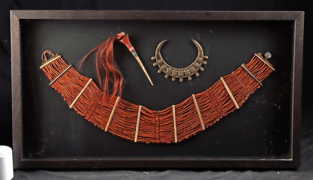 Naga Belt, Bone Hair Pin & Brass Trophy Head Necklace: Ca. 1901–1934 CE. South Asia, Northeastern India to Burma, Naga Konyak culture, ca. early to mid-20th century CE. A striking ethnographic display featuring three traditional adornments from the 