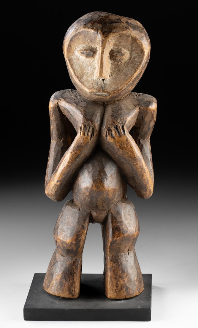 Lega Wood Iginga Sculpture - Nude Female: Ca. 1901–1934 CE. Central Africa, Democratic Republic of the Congo, Lega, ca. early to mid-20th century CE. A powerfully abstracted standing female figure, this Lega Iginga embodies moral author
