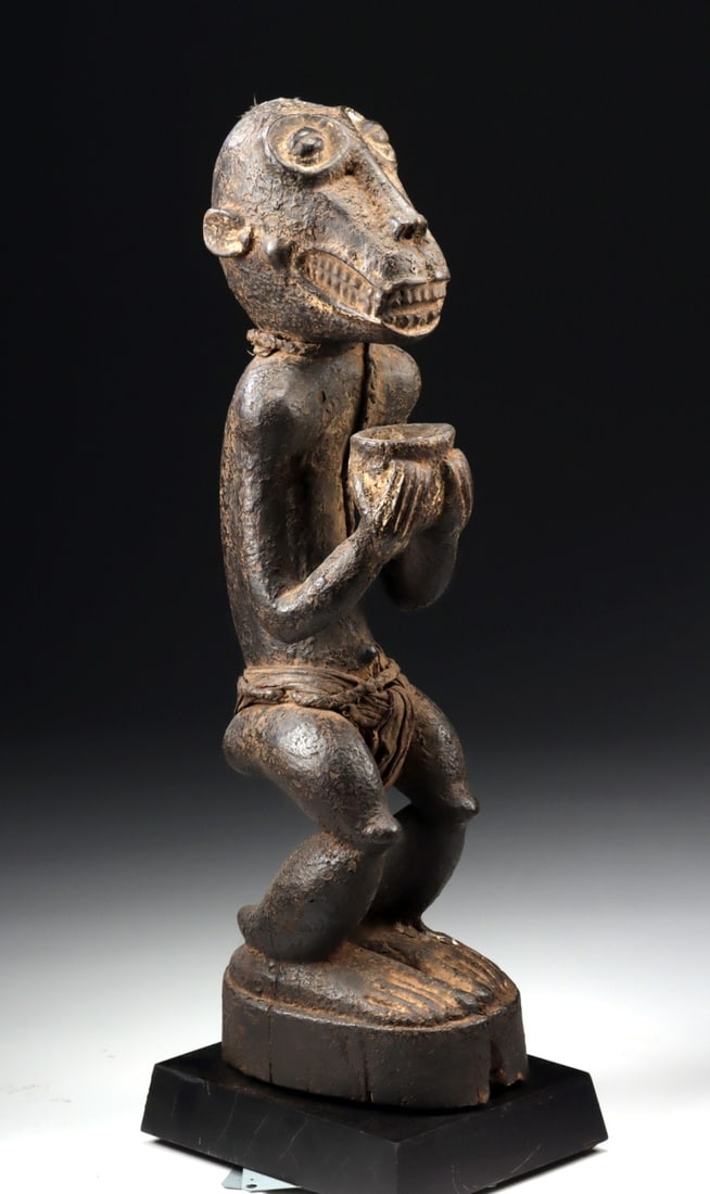 African Baule Wooden Monkey Figure for Mbra Divination: Ca. 1901–1934 CE. Africa, West Africa, Cote d'Ivoire (Ivory Coast), Baule culture, ca. early to mid-20th century CE. A striking hand-carved wooden figure of a monkey used in mbra divination ritu