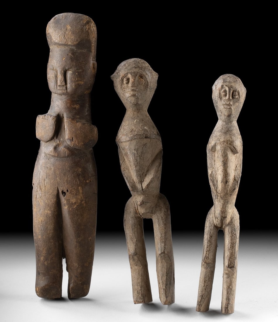 Three Lobi Wood Bateba Shrine Figures - Burkina Faso: Ca. 1901–1934 CE. West Africa, Burkina Faso, Lobi peoples, ca. early to mid-20th century CE. A compelling group of three carved wooden bateba shrine figures created by Lobi artists of southweste