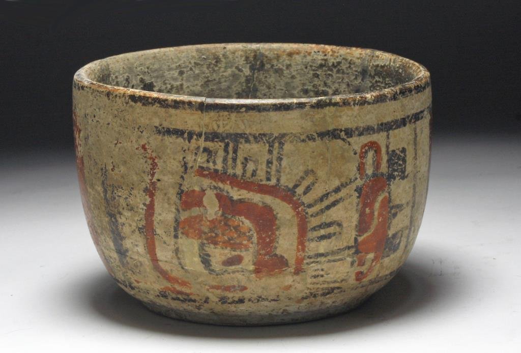 Mayan Footed Bowl - Stylized Glyphs: Peten Region, Guatemala, ca 550 to 850 CE. Hand built footed bowl ornamented with red and deep brown stylized glyphs on cream ground. 6 1/4" D x 4 1/2" H. PROVENANCE: EX-Adeon Gallery, Chicago, IL acq
