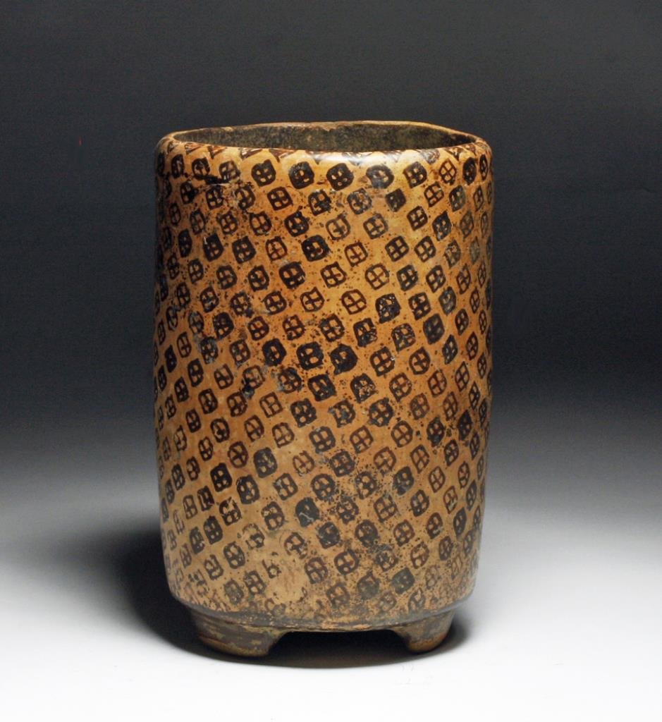 Mayan Cylinder - Jaguar Spot Pattern: Pre-Columbian, Mayan but in the Teotihuacanstyle , ca. 550-850 CE. Charming slab-footed, cylindrical vessel decorated with jaguar spot pattern painted in deep brown. 8"H x 5 1/4" D. PROVENANCE: Ex-pri