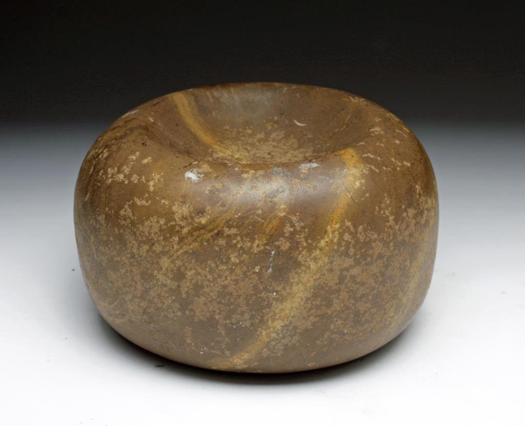 Large Mississippian Stone "Cupped" Discoidal: Jersey County, IL. Ca 1000 CE. Large round and cupped stone discoidal, used by early Mississippian/Mound Builder tribes in the ancient spear throwing game of Chungke. Great patina and signs of use! 4-