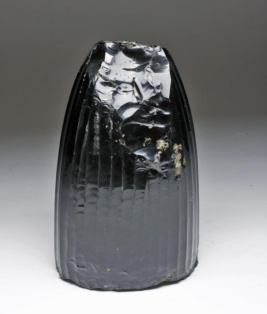 World-Class Aztec Obsidian Core: Central Mexico, Valley of Mexico, Ca 1000 to 1500 CE. Possibly the world's largest and most important obsidian core! Single football sized chunk of obsidian from which 37 distinct micro blades (as wel