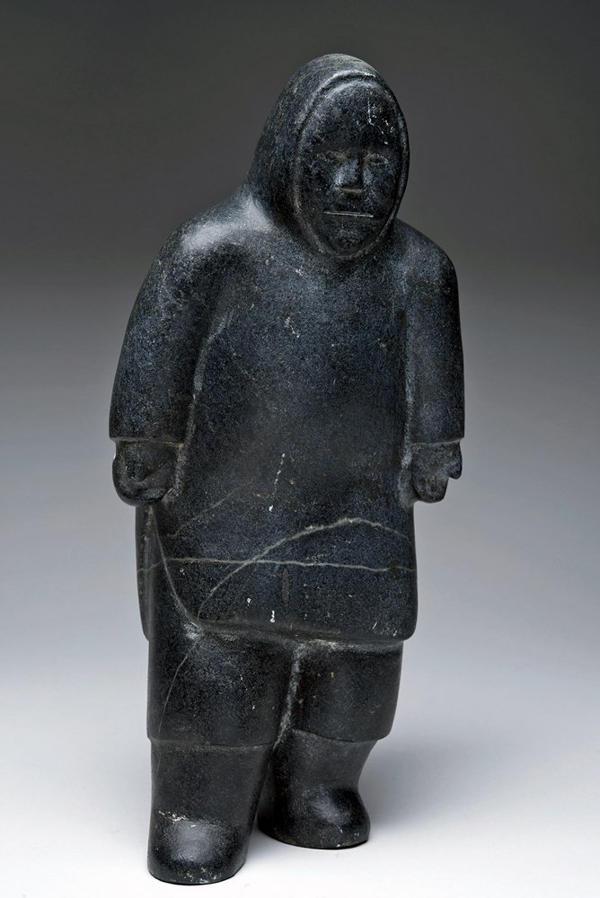 Eskimo Native Black Stone Figure: Alaska, North America, Inuit, ca. 1920. The Inuit sculptural tradition extends prior to contact with the Western world and Inuit artists continue to carve pieces completely by hand. This piece, made o