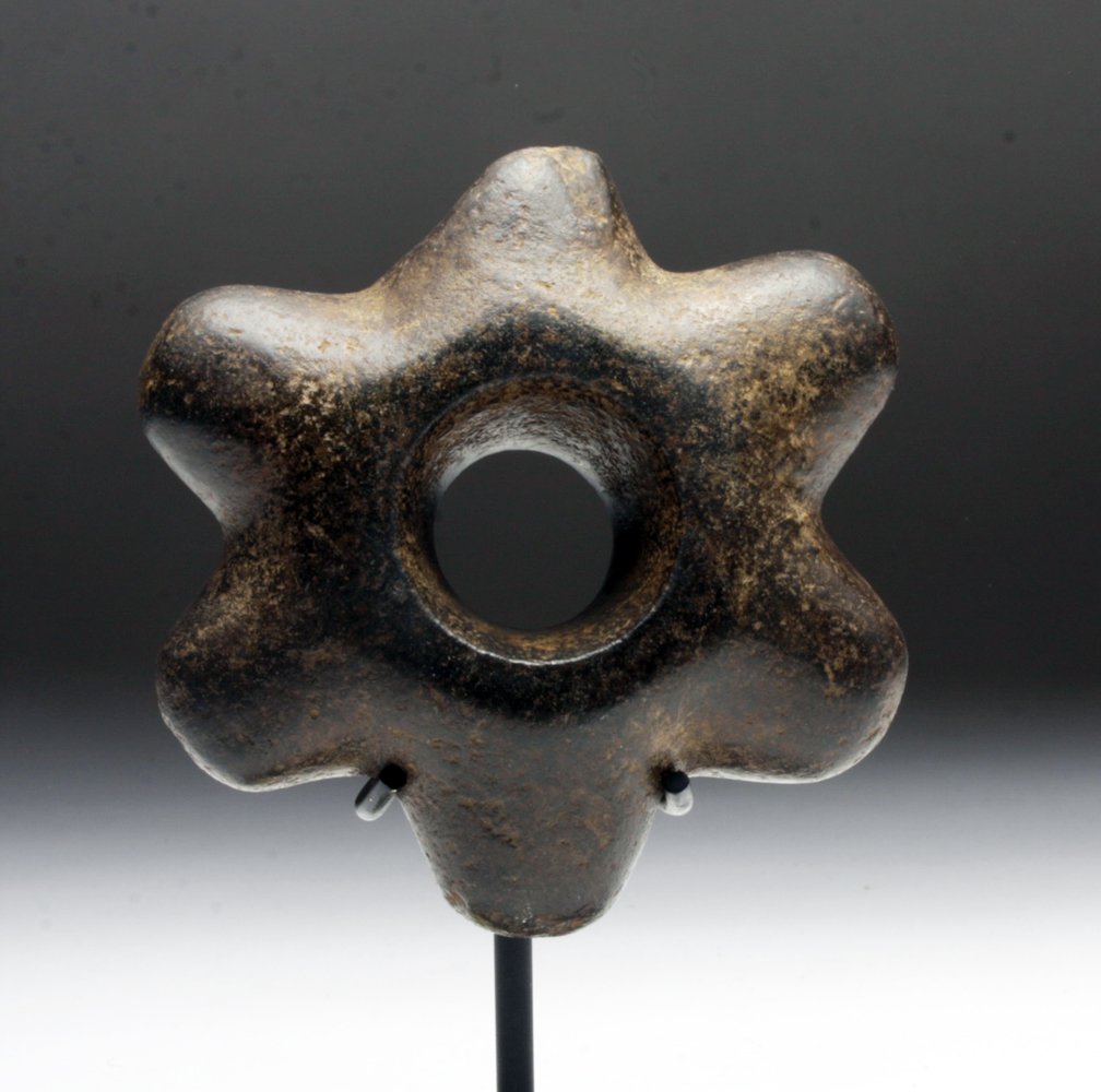 Pre-Columbian Chavin Stone Star Mace Head: Northern Peru, Chavin, ca. 900-500 BCE. Stone mace head in the form of a six-pointed star. Incredibly heavy or fierce. Based upon wear patterns, it seems that one point in particular was favored to in