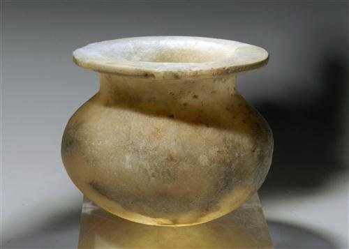 Large Phoenician Alabaster Vessel: Southern Mediterranean, ca. 400 BCE. Alabaster vessel with globular body, short cylindrical neck and a flat over-hanging rim. 3-1/4"H x 4"D. Provenance: Ex-Private New York Collection All items in thi