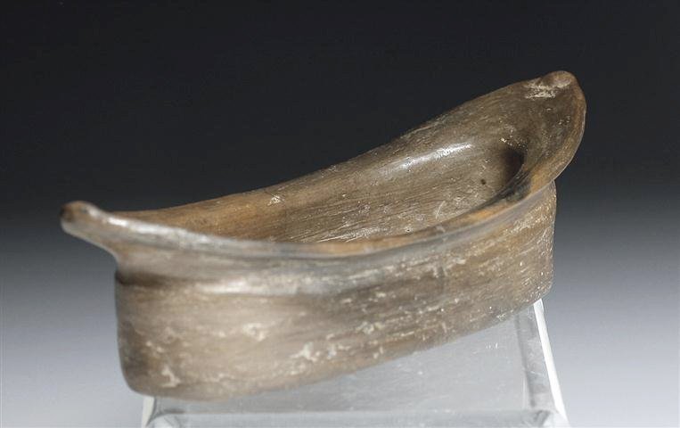 Rare Chupicuaro Canoe-Shaped Bowl: Pre-Columbian, Guanajuato Valley, western Mexico, Ca 500 to 300 BCE. A lovely little pottery brownware bowl shaped like a canoe, with straight sides and flared rim. Perhaps an effigy vessel or used fo