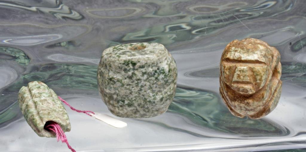 Lot of 3 Pre-Columbian Speckled Greenstone Beads: Guerrero, Mexico, Mezcala, Late Preclassic 400-100 BCE. These finely carved, green speckled hardstone beads reveal the hallmarks of Mezcala abstract sculptural style and string-cut technique. One feat