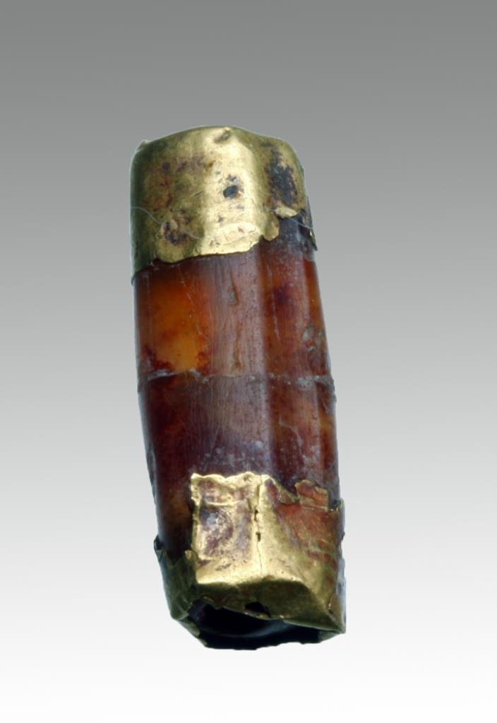 Roman Carnelian / Gold Bead: Rome, ca. 1st - 4th century CE. Carved carnelian bead with gold through center and gold leaf wrapped around ends. Could make a nice center piece on a necklace! 3/4"L. Provenance: Ex-Private Boulder, C