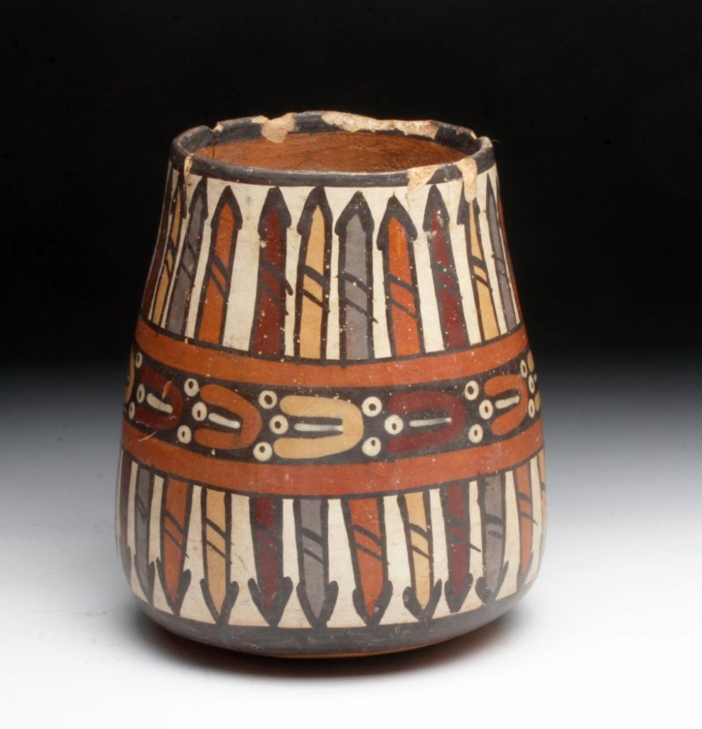 Nazca Polychrome Olla - Floating Abstract Figures: Southern Peru, Nazca, ca. 200 to 400 CE. This Nazca olla is remarkable for the bold painting of floating abstract figures in the middle register bordered by arrow/spear forms in the upper and lower re