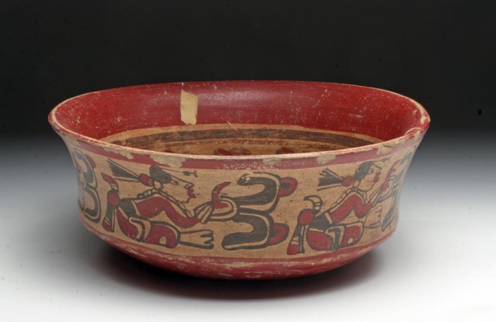 Mayan Copador Bowl: Pre-Columbian, Mayan territories, ca. 600 to 900 CE. Hand built bowl is rich for its iconography painted in deep red and brown slip on a cream ground. The interior features a large JAL sign also known