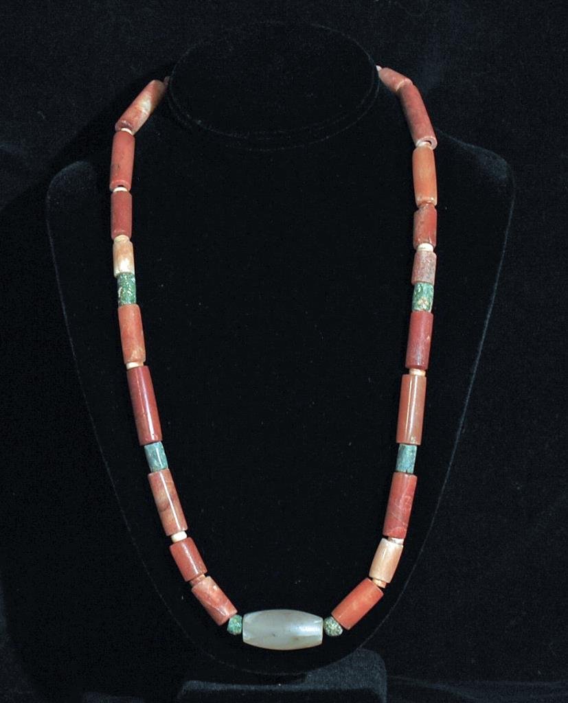 Pre-Columbian Tairona Carnelian Necklace: Tairona culture, ca. 500 - 1000 CE. Consisting of ancient carnelian, greenstone and one quartz bead. Strand is 25" long. Beartiful beads and design. Provenance: Ex-New World Artifacts, CA All items in