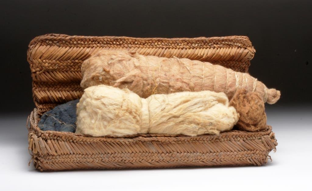 Pre-Columbian Chimu / Chancay Sewing Basket: Peru, ca. 1000 to 1200 CE. Basket woven in rectangular form filled with large balls of original wool, some dyed in various shades, set of spindle whorls with original sticks and a small skein of human