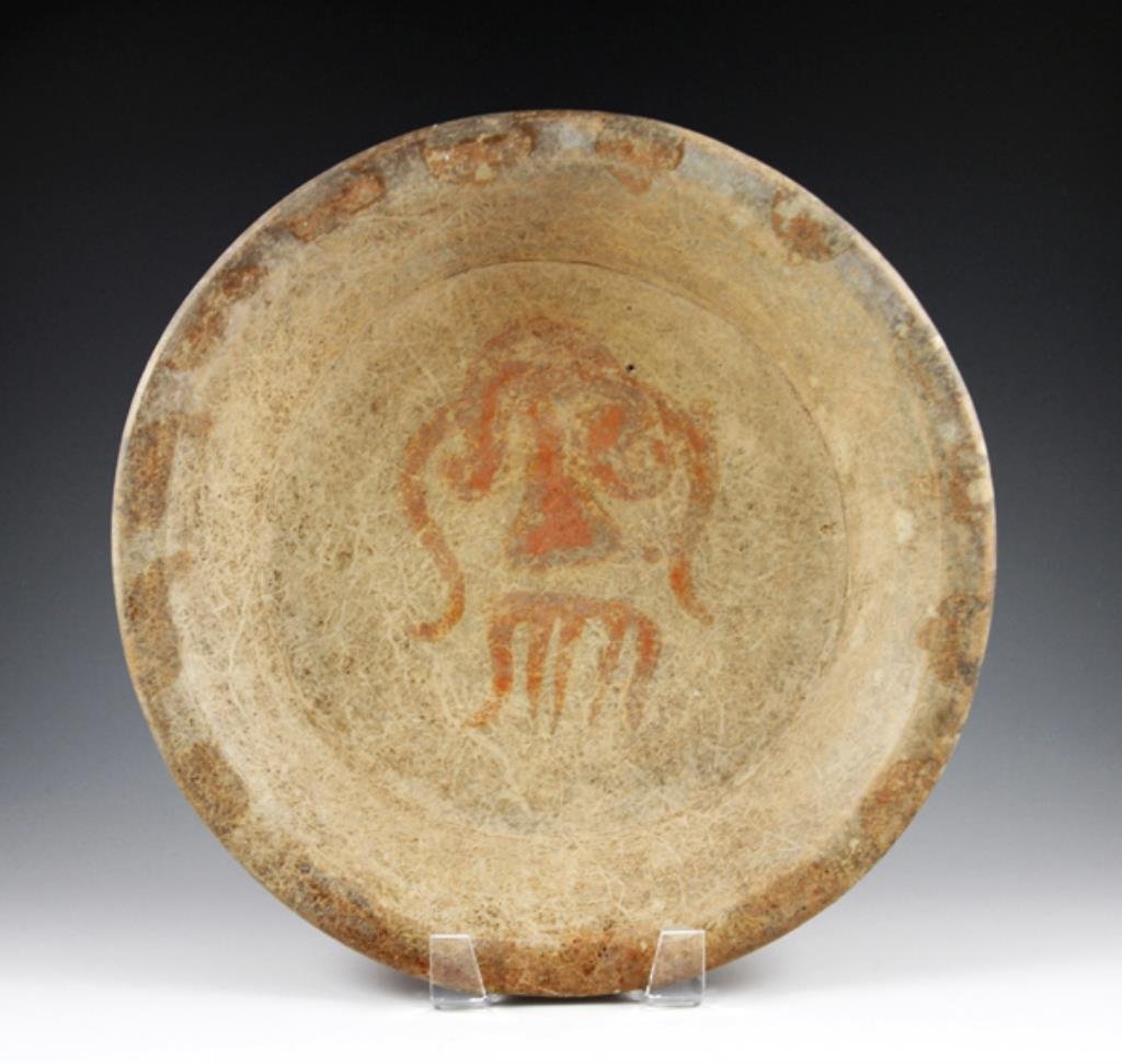 Rare Pre-Columbian Maya Slateware Chac Plate: Ancient Yucatan Maya regions, Mexico, circa 900 - 1000 CE. Measures approximately 11-1/2" in diameter. Includes acrylic display stand, as shown. This rare type of Maya plate sits atop three "T" shaped