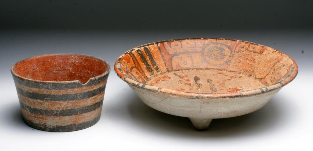 Lot of 2 Pre-Columbian Mayan Bowls: Mayan Territories, ca. 600-900 CE. This pair of hand built and painted bowls reveals the artistry of the ancient Mayans. The larger bowl, though quite eroded on the base shows a rather large and expre