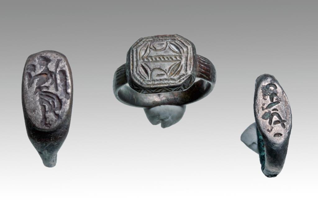 Lot of 3 Antique Islamic Silver Rings: Near East, ca. 1800 CE. A trio of silver rings with incised designs on each table. Tables have geometric design, characters, and a human form. 1-3/4"L to 2-3/8"L. Provenance: Ex-Private Boulder, CO Co