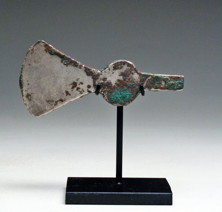 Pre-Columbian Inca Silver Tumi: Peru, Inca, ca. 1200-1500 CE. This stunning example of a Peruvian tumi is made from silver and shows gorgeous form and aging. The tumi is a ceremonial knife used in sacrificial rituals. The Inca used